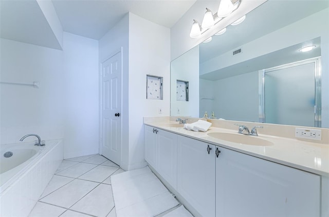 16600 Gulf Blvd Unit 437, North Redington Beach, FL 33708 - full bathroom featuring double vanity, a bath, tile patterned floors, and a shower with door