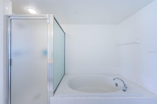 16600 Gulf Blvd Unit 437, North Redington Beach, FL 33708 - full bathroom featuring a stall shower and a garden tub