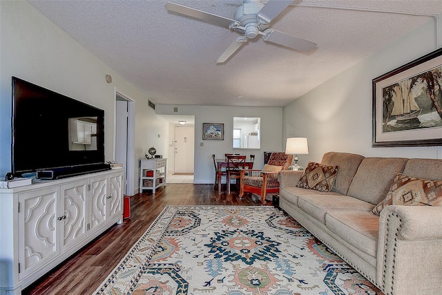 11485 Oakhurst Rd Unit 310, Largo, FL 33771 - living area featuring ceiling fan, a textured ceiling, and dark wood finished floors