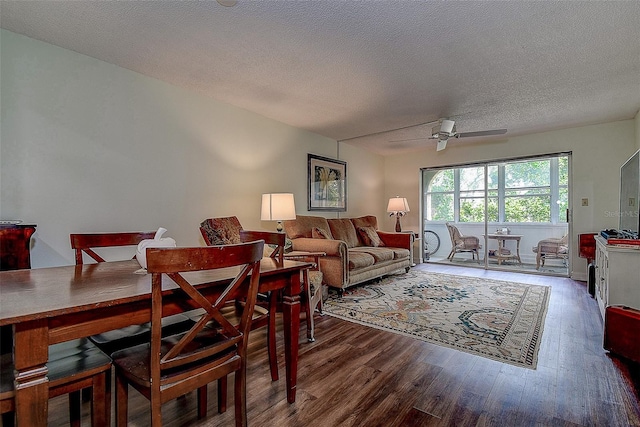 11485 Oakhurst Rd Unit 310, Largo, FL 33771 - dining space featuring wood finished floors, ceiling fan, and a textured ceiling