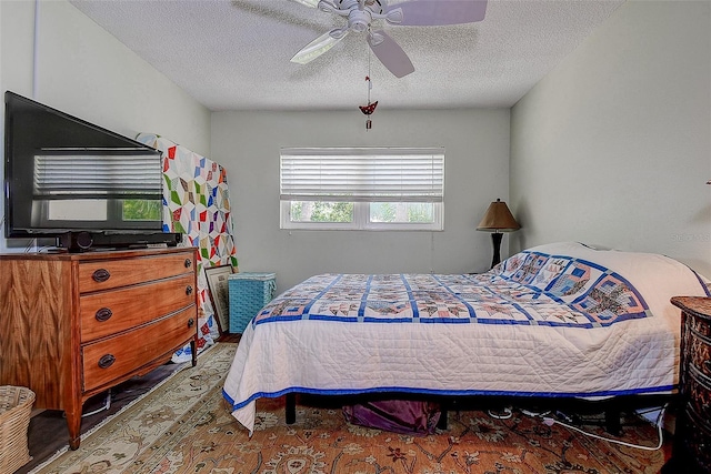 11485 Oakhurst Rd Unit 310, Largo, FL 33771 - bedroom with a textured ceiling and a ceiling fan