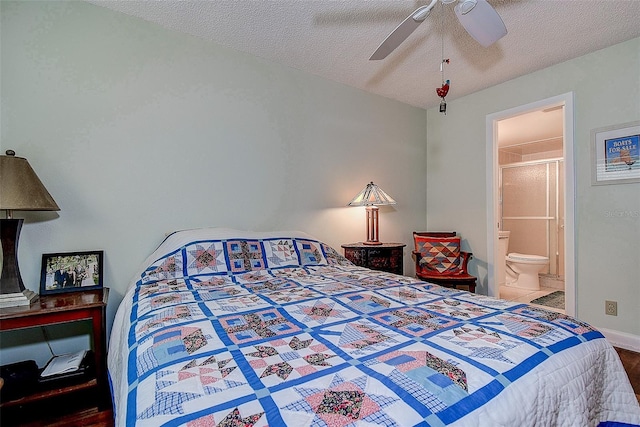 11485 Oakhurst Rd Unit 310, Largo, FL 33771 - bedroom with a textured ceiling, ensuite bath, wood finished floors, and a ceiling fan