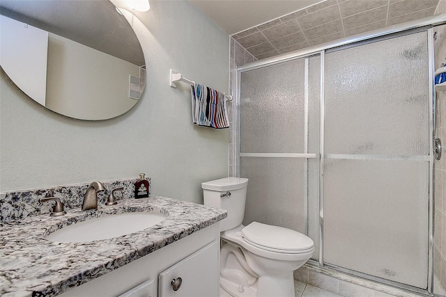 11485 Oakhurst Rd Unit 310, Largo, FL 33771 - full bathroom with vanity, a shower stall, and tile patterned flooring