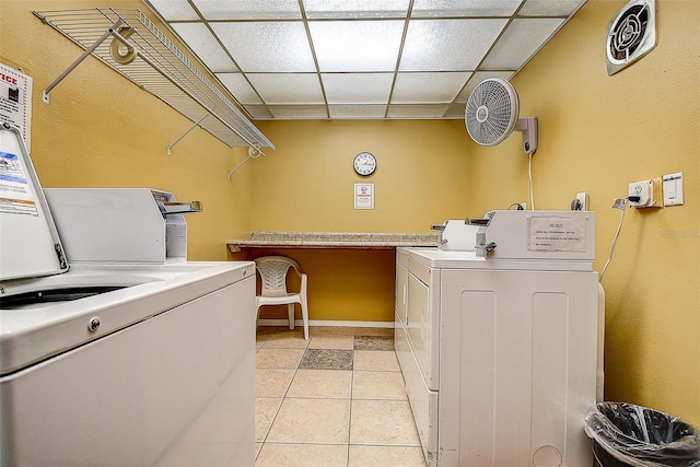 11485 Oakhurst Rd Unit 310, Largo, FL 33771 - washroom featuring washing machine and dryer and light tile patterned flooring
