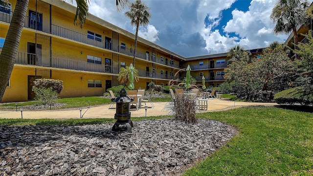 11485 Oakhurst Rd Unit 310, Largo, FL 33771 - view of community with a patio and a lawn