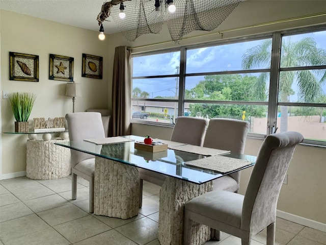 4712 Marine Pkwy Unit 203, New Port Richey, FL 34652 - dining space with a chandelier, healthy amount of natural light, and light tile patterned floors