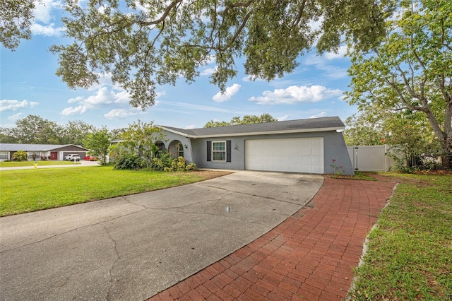 602 Hillpoint Way, Brandon, FL 33510 - ranch-style home with stucco siding, a garage, concrete driveway, and a gate