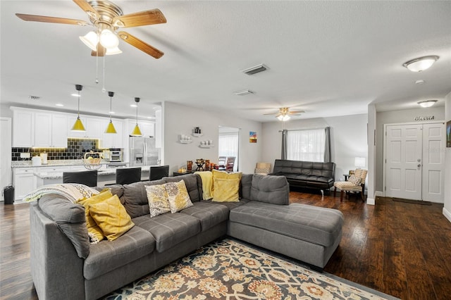 602 Hillpoint Way, Brandon, FL 33510 - living area with a ceiling fan and dark wood-style floors