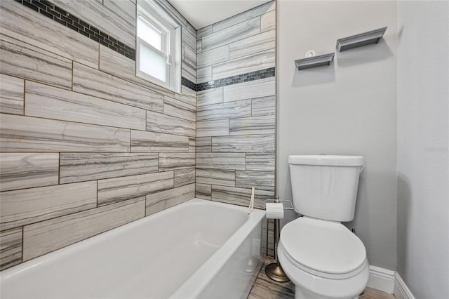 602 Hillpoint Way, Brandon, FL 33510 - bathroom with baseboards and washtub / shower combination