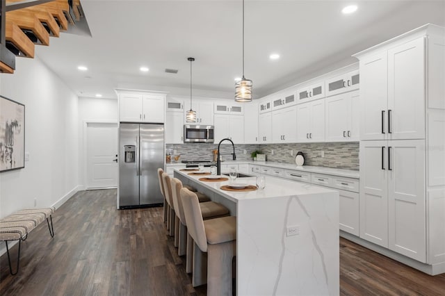 6206 64th Way N, Pinellas Park, FL 33781 - kitchen featuring stainless steel appliances, backsplash, dark wood-style floors, white cabinetry, and recessed lighting