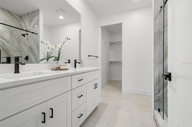 6206 64th Way N, Pinellas Park, FL 33781 - full bath with double vanity, a marble finish shower, recessed lighting, tile patterned floors, and a walk in closet