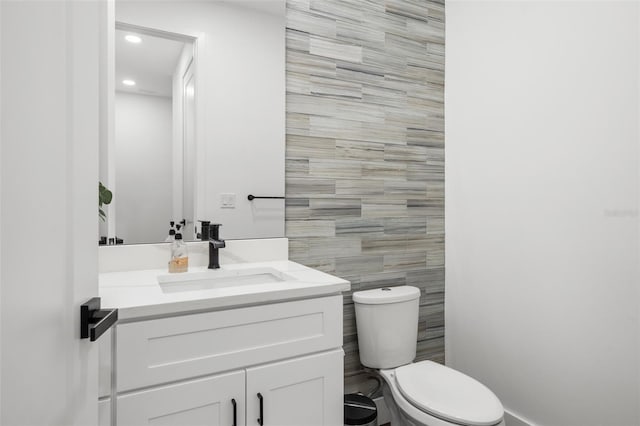 6206 64th Way N, Pinellas Park, FL 33781 - half bath featuring vanity, tile walls, and recessed lighting