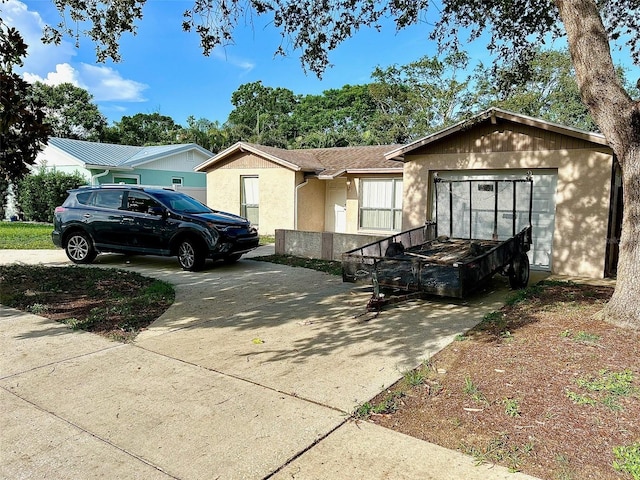 8801 Orange Blossom Dr, Seminole, FL 33772 - ranch-style house featuring stucco siding and driveway