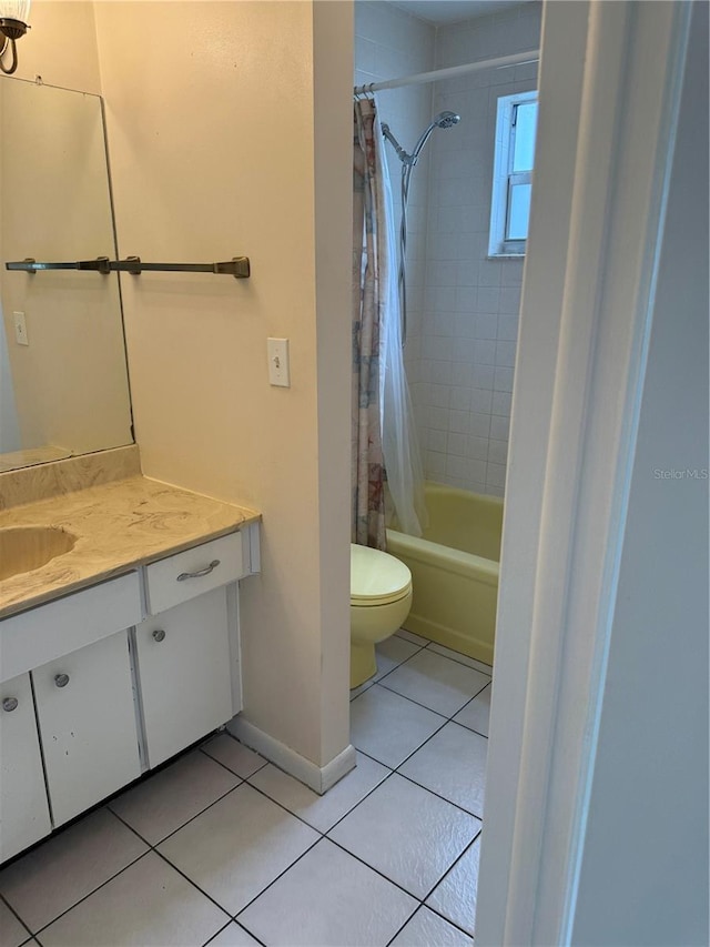 8801 Orange Blossom Dr, Seminole, FL 33772 - bathroom featuring tile patterned floors, vanity, and shower / bathtub combination with curtain