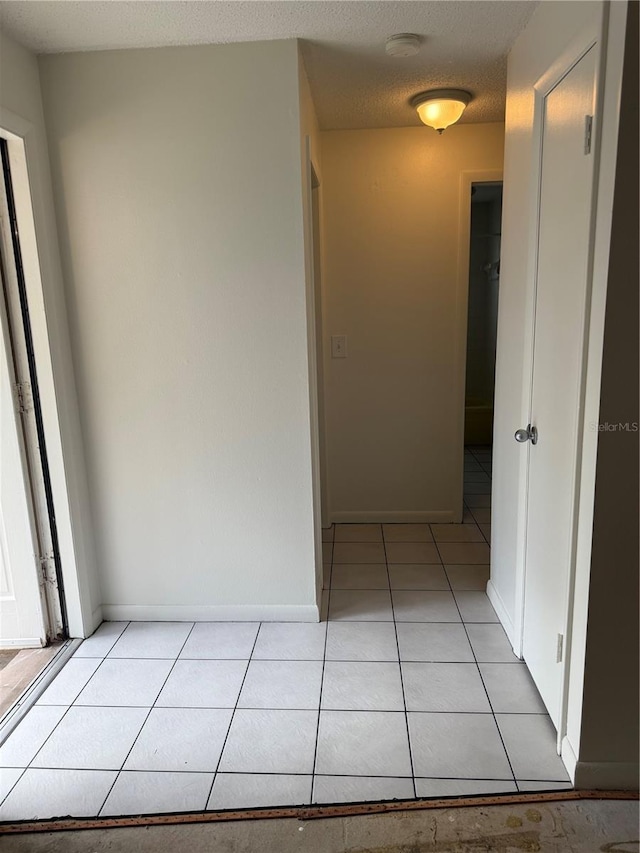 8801 Orange Blossom Dr, Seminole, FL 33772 - hallway featuring light tile patterned floors