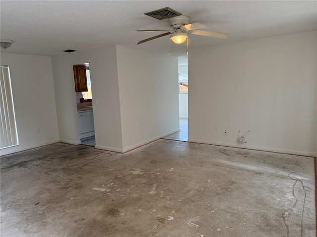 8801 Orange Blossom Dr, Seminole, FL 33772 - unfurnished room with a ceiling fan, unfinished concrete floors, and a textured ceiling