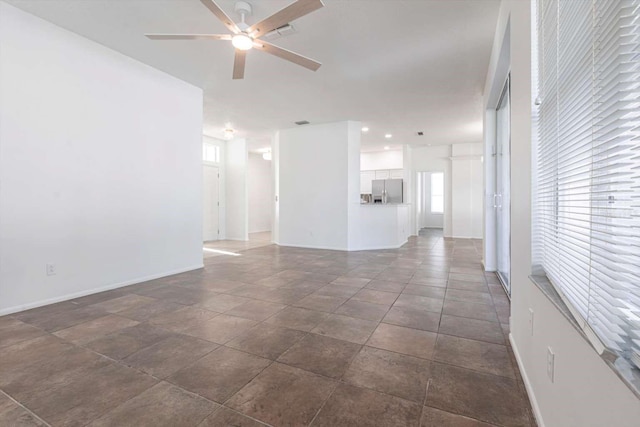 5017 46th St W, Bradenton, FL 34210 - unfurnished living room featuring ceiling fan and healthy amount of natural light