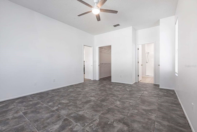 5017 46th St W, Bradenton, FL 34210 - spare room featuring a ceiling fan and a textured ceiling