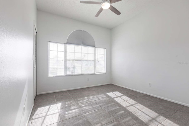 5017 46th St W, Bradenton, FL 34210 - tiled empty room featuring ceiling fan and baseboards