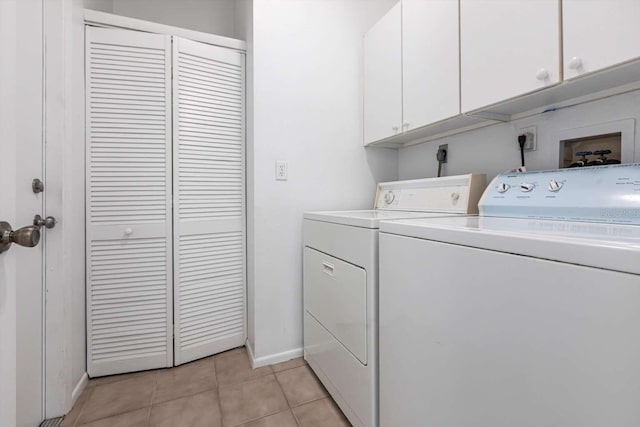 5017 46th St W, Bradenton, FL 34210 - laundry area featuring cabinet space, washer and clothes dryer, and light tile patterned floors