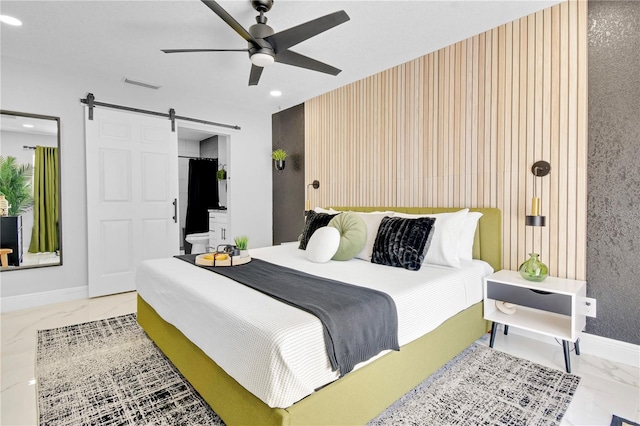8010 W Hiawatha St, Tampa, FL 33615 - bedroom with marble finish flooring, a barn door, recessed lighting, and ceiling fan