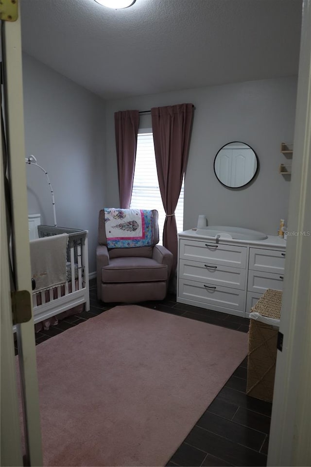 1006 Harvest Moon Dr, Seffner, FL 33584 - bedroom with wood tiled floors and a nursery area