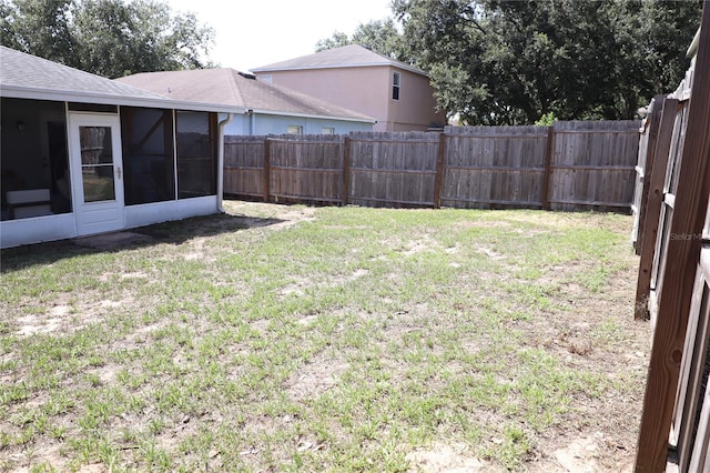 1006 Harvest Moon Dr, Seffner, FL 33584 - fenced backyard with a sunroom