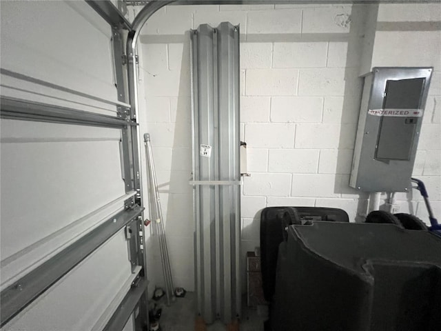 3724 Crofton Ct, Fort Myers, FL 33916 - washroom featuring electric panel, concrete block wall, and a garage