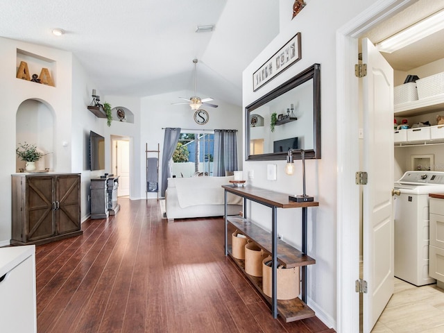 24811 Gun Smoke Dr, Land O Lakes, FL 34639 - hallway featuring washer / clothes dryer, wood finished floors, and lofted ceiling