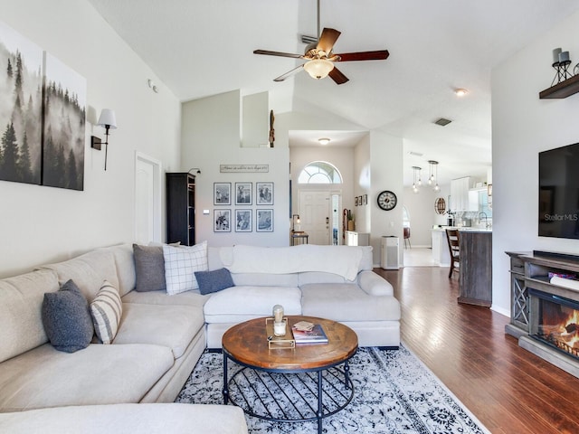 24811 Gun Smoke Dr, Land O Lakes, FL 34639 - living room with ceiling fan, dark wood-style floors, and high vaulted ceiling