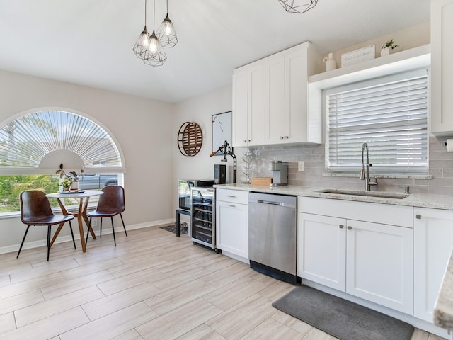 24811 Gun Smoke Dr, Land O Lakes, FL 34639 - kitchen with stainless steel dishwasher, plenty of natural light, and backsplash
