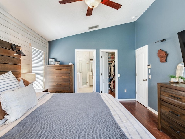 24811 Gun Smoke Dr, Land O Lakes, FL 34639 - bedroom with vaulted ceiling, a spacious closet, wood finished floors, a closet, and ceiling fan