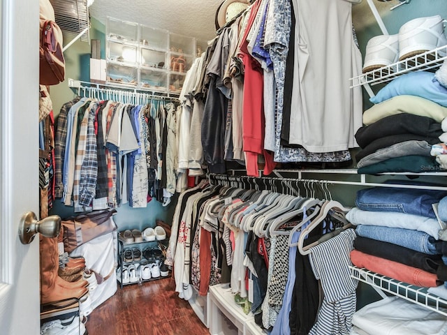 24811 Gun Smoke Dr, Land O Lakes, FL 34639 - walk in closet featuring wood finished floors