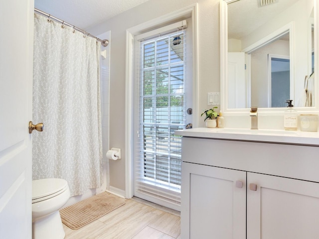 24811 Gun Smoke Dr, Land O Lakes, FL 34639 - full bath with vanity, a shower with shower curtain, and wood finished floors