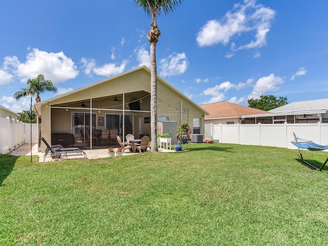 24811 Gun Smoke Dr, Land O Lakes, FL 34639 - rear view of house featuring ceiling fan, a fenced backyard, a patio, and stucco siding