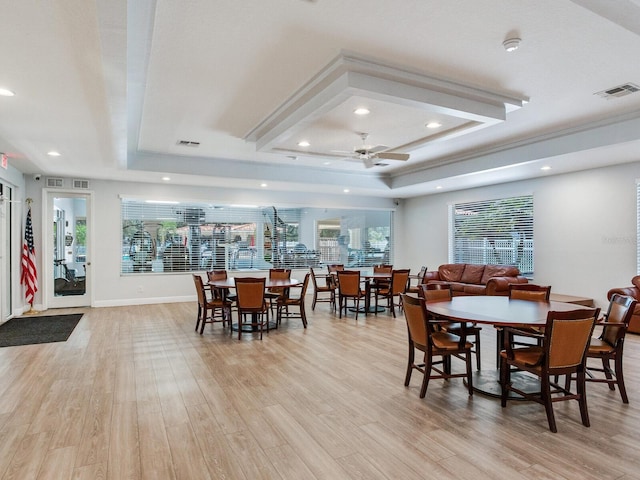 24811 Gun Smoke Dr, Land O Lakes, FL 34639 - dining space featuring a raised ceiling, a ceiling fan, light wood-style floors, and recessed lighting