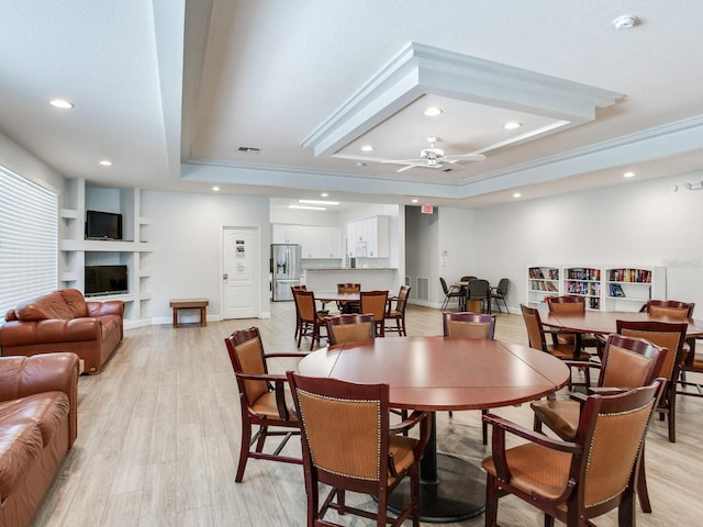24811 Gun Smoke Dr, Land O Lakes, FL 34639 - dining area with a raised ceiling, light wood-style floors, recessed lighting, and a ceiling fan