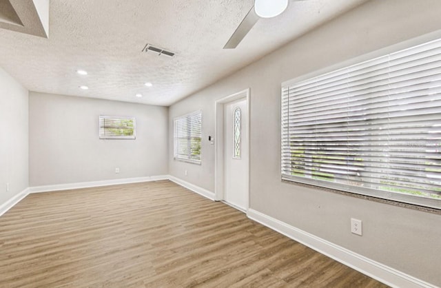 10215 N 23rd St, Tampa, FL 33612 - entryway with a textured ceiling, a ceiling fan, wood finished floors, and recessed lighting