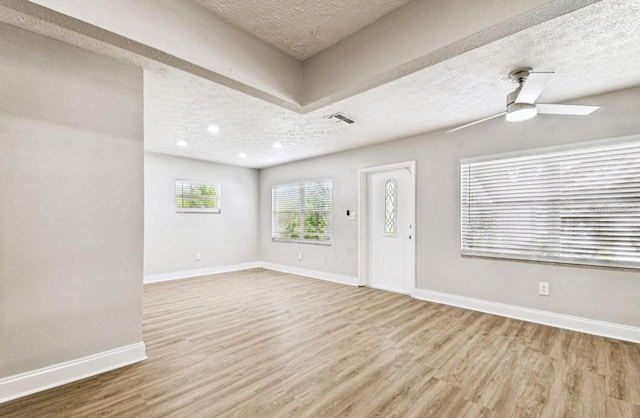 10215 N 23rd St, Tampa, FL 33612 - foyer entrance with a textured ceiling, wood finished floors, and a ceiling fan