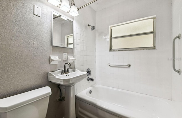 10215 N 23rd St, Tampa, FL 33612 - bathroom featuring washtub / shower combination and a textured wall
