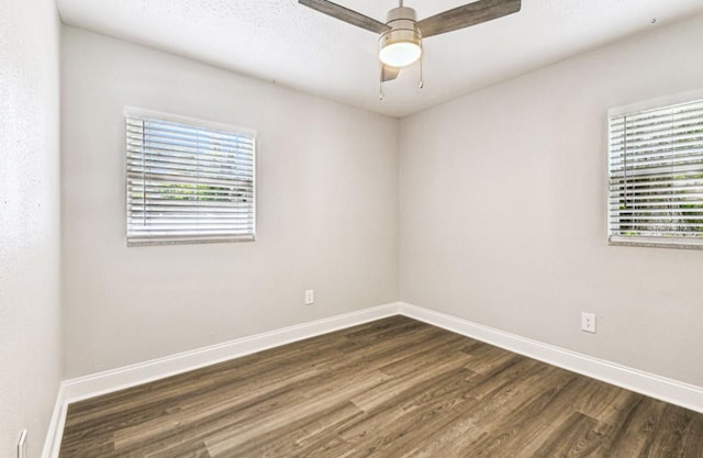 10215 N 23rd St, Tampa, FL 33612 - empty room featuring dark wood-style flooring and ceiling fan