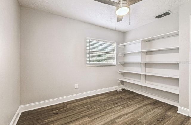 10215 N 23rd St, Tampa, FL 33612 - spare room with dark wood finished floors, a textured ceiling, and a ceiling fan