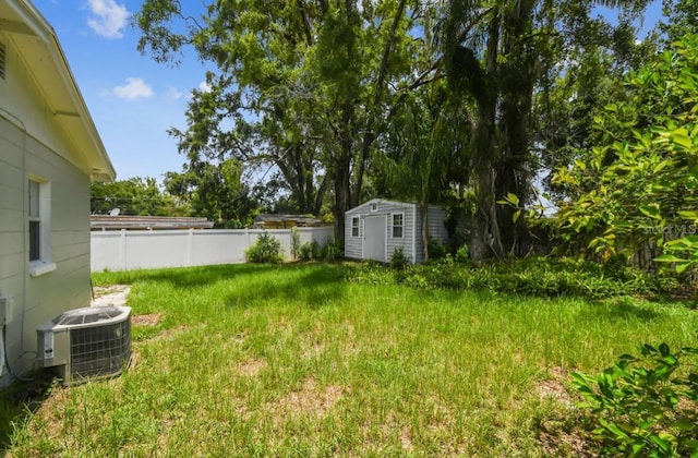 10215 N 23rd St, Tampa, FL 33612 - fenced backyard featuring a storage unit