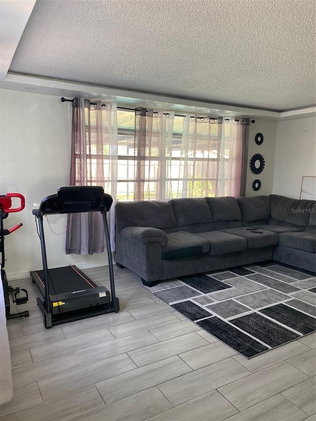 4219 Gray Squirrel Ln, New Port Richey, FL 34653 - living area with a textured ceiling, plenty of natural light, and wood finish floors