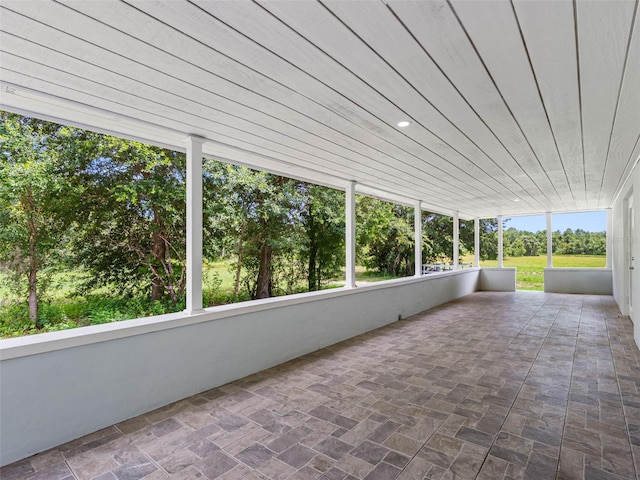 2440S Wallace Rd, Bartow, FL 33830 - unfurnished sunroom with healthy amount of natural light and view of scattered trees