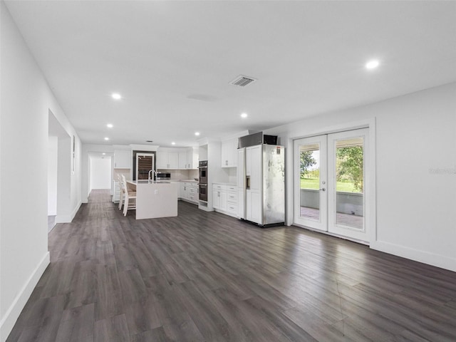 2440S Wallace Rd, Bartow, FL 33830 - unfurnished living room featuring recessed lighting and dark wood-style floors