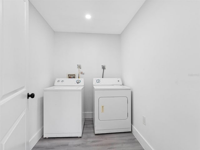 2440S Wallace Rd, Bartow, FL 33830 - laundry area featuring washer and dryer, light wood-style flooring, and recessed lighting