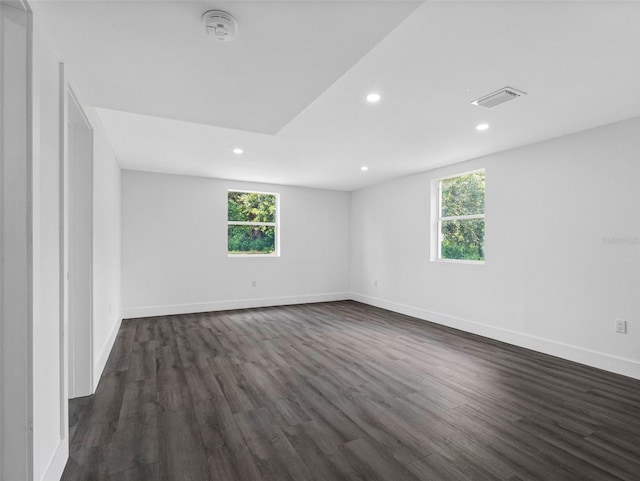 2440S Wallace Rd, Bartow, FL 33830 - spare room featuring healthy amount of natural light, recessed lighting, dark wood-type flooring, and a smoke detector
