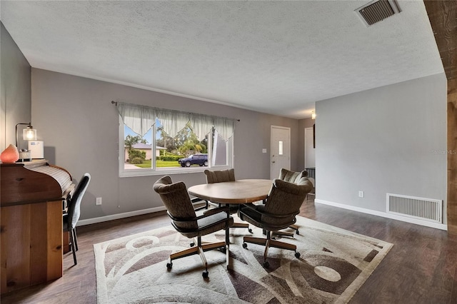 2914 Forest Cir, Seffner, FL 33584 - dining room featuring a textured ceiling, wood finished floors, and a desk