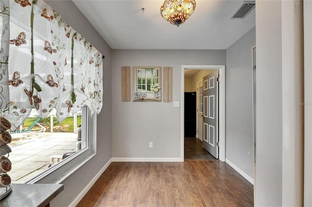 2914 Forest Cir, Seffner, FL 33584 - unfurnished room with plenty of natural light and wood finished floors